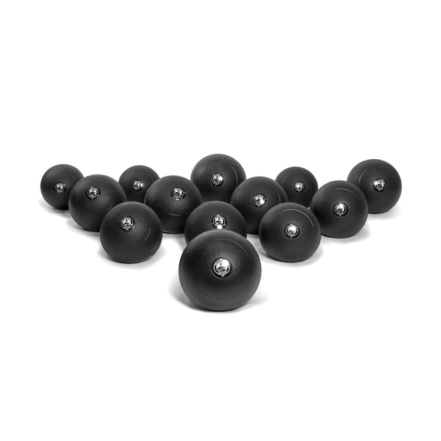A set of Bells of Steel Slam Balls in different sizes form a triangular pattern on a white background. Each black ball shows its metallic core at the top, ideal for adding explosive power to your cardio workouts.
