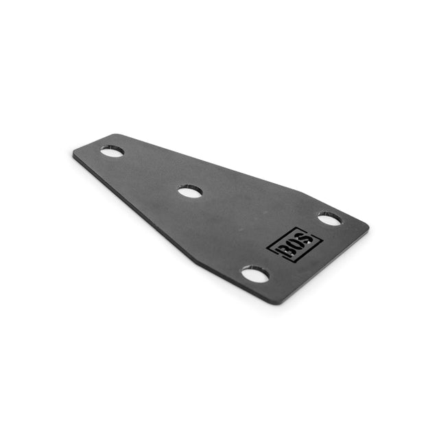 The Hydra Bumper Plate Tree Reinforcement Plates by Bells of Steel is a flat, black metal bracket featuring a logo and five evenly spaced holes. This triangular piece with rounded edges resembles reinforcement plates on a plain white background.