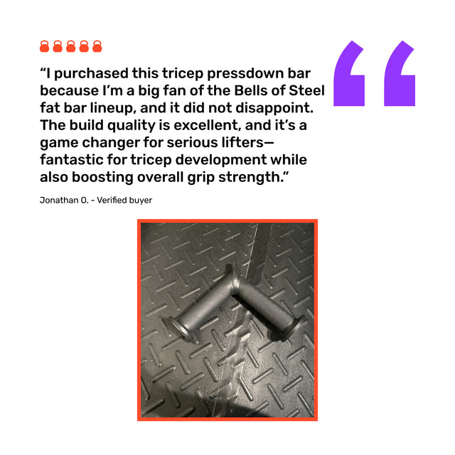 The Bells of Steel Fat Bar - Tricep Pressdown, featuring textured handles, sits on a diamond-plate gym floor. A review highlights its sturdy build and effectiveness as a tricep pushdown attachment for grip strength and tricep gains.