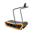 The Bells of Steel Wooden Residential Manual Treadmill is a curved, self-powered treadmill with a wooden frame, black running surface with impact-absorbing slats, a simple black handlebar, and a small top-mounted display screen.