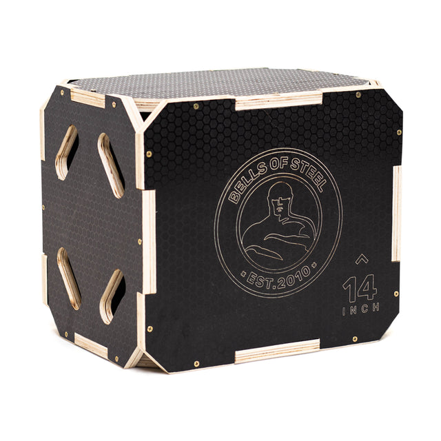The Bells of Steel 3 in 1 Anti-Slip Wood Plyo Box features black and wood finishes, hexagonal anti-slip patterns, cutout handles, a strongman graphic, and is labeled "14 inch"—ideal for any home gym setup.