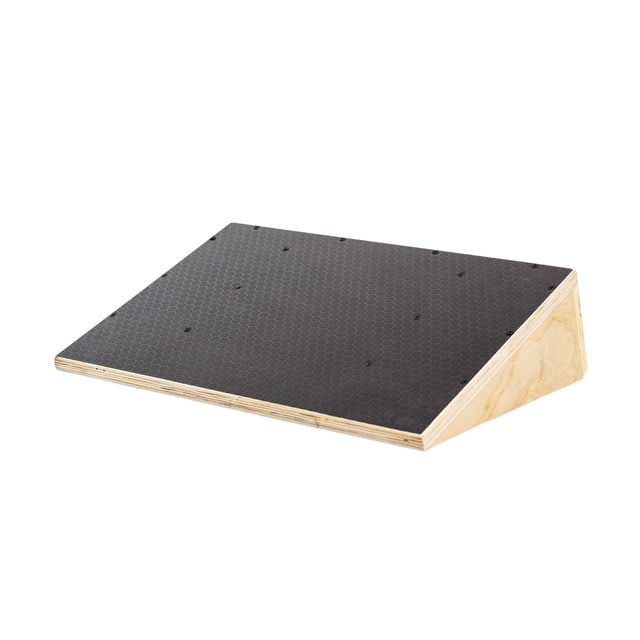 The Bells of Steel Squat Wedge Board features a black textured top and is designed to enhance ankle mobility and squat depth during stretching or physical therapy.