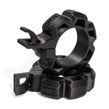 Two black Barbell Zip Clips - Half Standard (Pair) by Bells of Steel are stacked together, featuring rugged plastic build, gear-like edges, hooks, and "EOS" embossed on the surface.