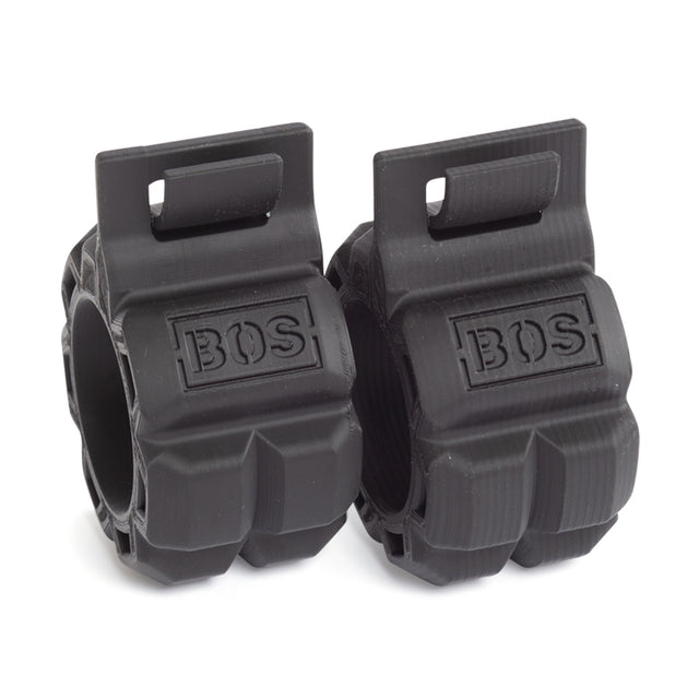 Two black, textured Barbell Zip Clips by Bells of Steel with "BOS" embossed on each. Their rugged, chunky design and top slots resemble 3D printed barbell collars—ideal for securing weights on gym equipment.