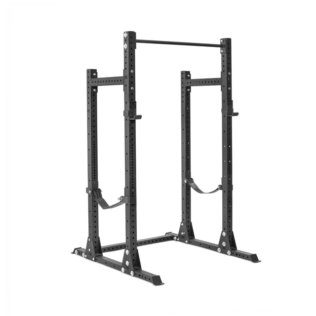 The Bells of Steel Hydra Half Rack - Prebuilt (3" x 3", ⅝" Holes) is a black metal weightlifting rack with adjustable safety straps and multiple barbell height options, perfect for strength training in your home gym.
