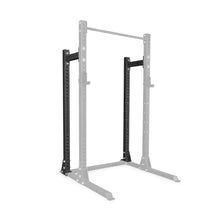 A Bells of Steel Half Rack Conversion Kit is shown with two black vertical support beams highlighted, illustrating its modular design, while the rest of the frame is greyed out to emphasize the featured components.
