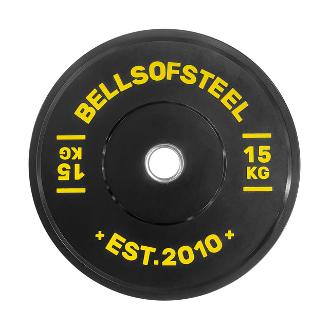 The Bells of Steel Dead Bounce Conflict Bumper Plate is a black 15 kg virgin rubber weight plate with yellow text: "BELLSOFSTEEL," "15 KG," "EST. 2010," and "1.5" near the center—ideal for weightlifting and bumper plate sets.