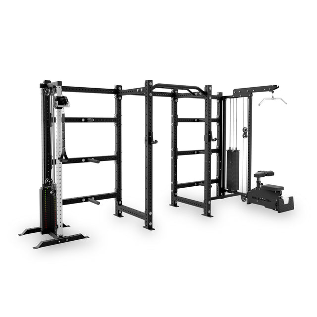 The Bells of Steel Kolossyem Rack is a large, black all-in-one home gym with a power rack, cable pulley system, pull-up bars, seated lat pulldown machine, sturdy metal frames, and weight stacks shown on a white background.