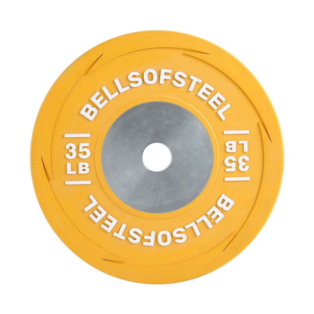 The yellow Boltless LB Competition Bumper Plate by Bells of Steel, weighing 35 lbs, features a metal center ring and "BELLSOFSTEEL" in white—a great choice for Olympic lifting and training routines.