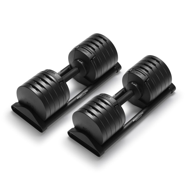 The Bells of Steel NÜOBELL-S Adjustable Dumbbells, featuring multiple weight options on sleek black trays, are a must-have for any home gym—shown here against a white background.