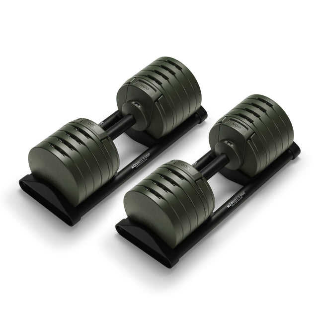 The Bells of Steel NÜOBELL-S Adjustable Dumbbells feature a sleek dark green and black design with multiple weight plates on a black base—perfect for any home gym setup.