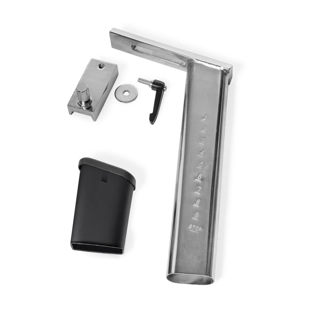 The Bells of Steel Blitz Air Bike Seat Adjustment Assembly includes a rectangular bracket, latch with lever, washer, and black plastic cover—components shown arranged on a white background.