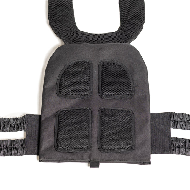 The Bells of Steel Weighted Vest features a close-up of its black padded shoulder strap with mesh cushioning for comfort. The adjustable strap connects to a cushioned section with four mesh-covered pads for ventilation, while elasticated bands on the sides ensure a snug fit during workouts.