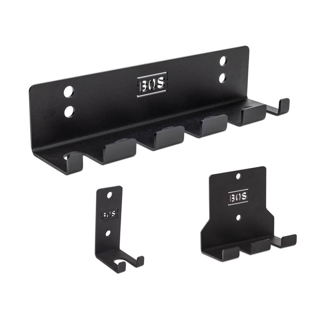 Three black metal hanging barbell holders from Bells of Steel are showcased against a white background. The largest holder is equipped with multiple hooks for secure storage, while the other two offer smaller configurations. All come with mounting holes and prominently display the "BOS" branding.