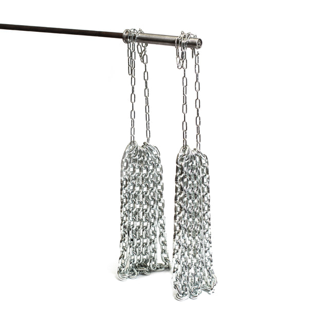 Weightlifting chains from Bells of Steel, crafted to resist rust, are arranged in loops and hang from a horizontal metal rod against a white background. These robust chains are interconnected, forming a series of long, durable loops suspended from the rod.