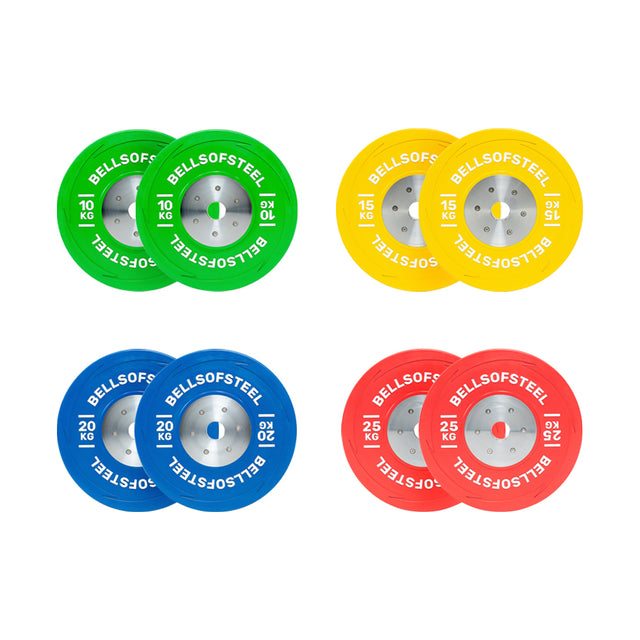 Four pairs of vividly colored weight plates are arranged in a grid. These KG Competition Bumper Plates, ideal for Olympic lifting, come in green (10 kg), yellow (15 kg), blue (20 kg), and red (25 kg) with "Bells of Steel" printed on them.