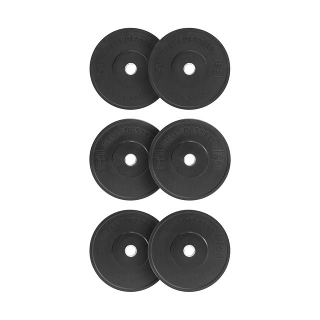 Six Bells of Steel All-Black Bumper Plates are set in two rows, each with engraved text around the center hole and featuring a durable stainless steel insert for optimal performance.