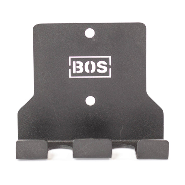 The Hanging Barbell Holders by Bells of Steel are black metal wall hooks equipped with three hooks and two pre-drilled mounting holes, offering perfect secure storage. Featuring a white "BOS" logo on the front, they add a touch of style.