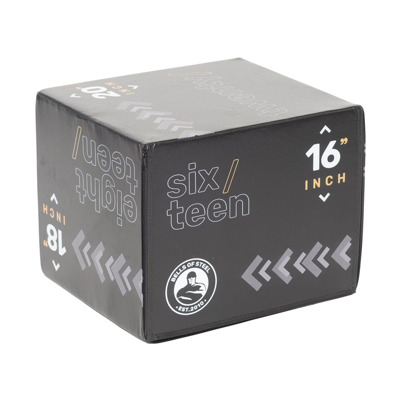 The Bells of Steel Foam Soft Plyo Box (16 x 18 x 20) is a versatile gym accessory in black leather featuring white and orange text with "sixteen" and "16 inch," a circular "LEVELS OF STEEL EST. 2020" logo, and dense foam surfaces adorned with diagonal arrow designs.
