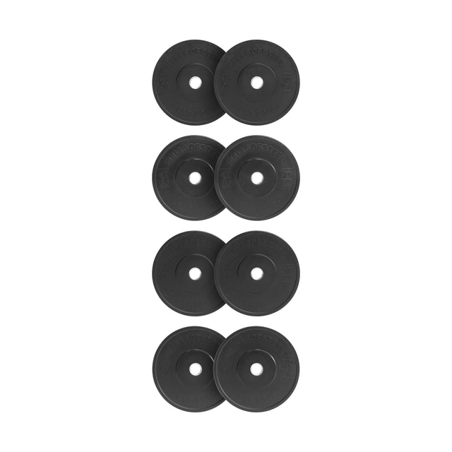 Eight Bells of Steel All-Black Bumper Plates are arranged vertically in two columns on a white background. Made from recycled rubber, each plate features engravings and a central hole with a stainless steel insert for barbell mounting.