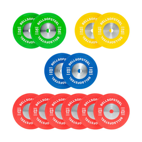 Four pairs of green (10 kg), yellow (15 kg), blue (20 kg), and five pairs of red (25 kg) Bells of Steel KG Competition Bumper Plate Sets, built to IWF specs for Olympic lifting, are neatly arranged on a white background.