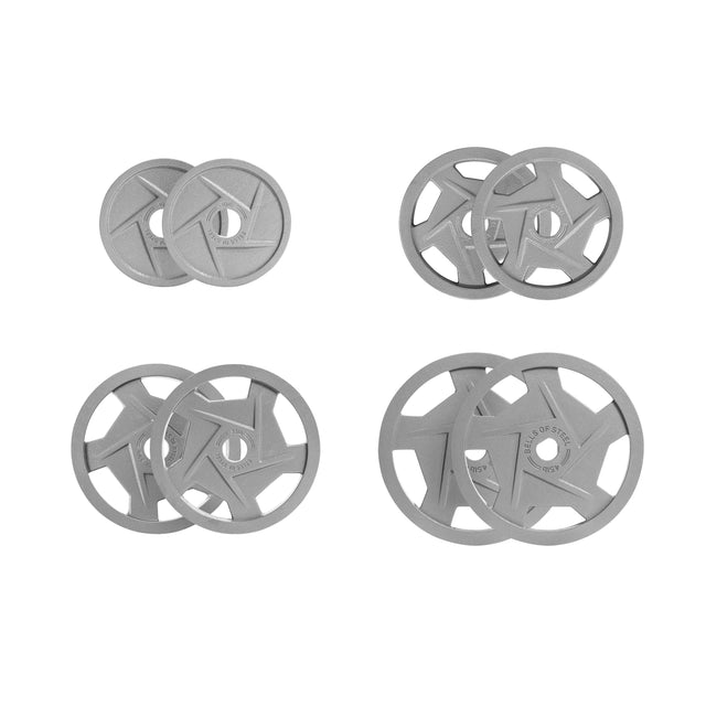 The Gray Mighty Grip Olympic Weight Plates by Bells of Steel are available in four ergonomically designed sets, organized into two columns. Each set showcases unique designs and openings to represent the different weight levels. Finished with a durable hammertone powder coat, these plates clearly display their specific weight specifications.