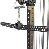 Close-up of a metal attachment on a fitness machine, showcasing the 30 D-Handle Bar Cable Attachment with Carabiners by Bells of Steel. Featuring a perforated design, it's connected by chains to a pulley system, allowing for adjustable cable attachments suitable for various strength training exercises.