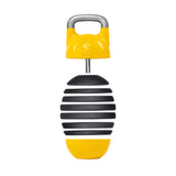 The Bells of Steel Adjustable Competition Kettlebell is a cylindrical, egg-shaped percussion instrument with alternating black and yellow stripes, a yellow handle for handheld use, and a small emblem on top, enhancing its unique design.