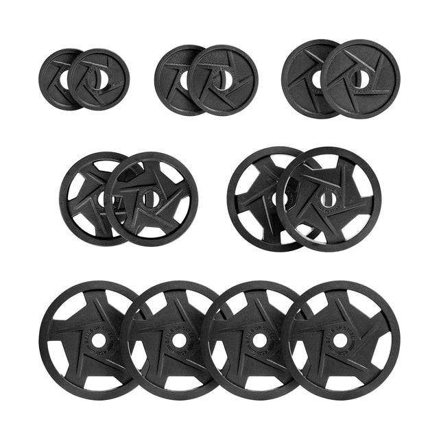 A set of Black Mighty Grip Olympic Weight Plates by Bells of Steel, complete with precision grip handles and a star-shaped design in the center, are neatly arranged. The plates are displayed in pairs, highlighting a variety of diameters.