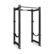The Bells of Steel Manticore Four Post Power Rack Builder (3" x 3", 1" Holes) is a black metal, freestanding power rack featuring adjustable safety straps, multiple attachment holes, and an integrated pull-up bar on top. Perfect for weightlifting and strength training, this sturdy rack stands on a white background and is ideal for any home gym setup.