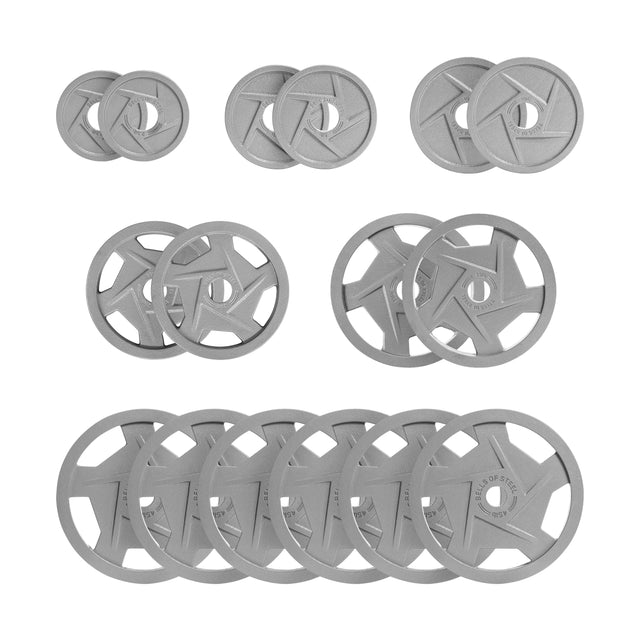 A collection of Gray Mighty Grip Olympic Weight Plates by Bells of Steel is displayed against a white background, featuring a star-shaped, ergonomic design. Each weight plate is crafted with a durable hammertone powder coat and arranged in rows to highlight their diverse sizes for easy comparison.