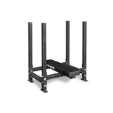 The Bells of Steel Four Post Converter Bench is a heavy-duty black steel bench with padding and upright supports, featuring multiple holes for adjustable barbell placement—ideal for any powerlifting gym.