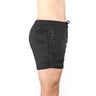 Side view of a person wearing Bells of Steel's black gym shorts with "BELLS OF STEEL" text on the side. Made from lightweight, durable, high-performance polyester with stretchy fabric for comfort, set against a white background.