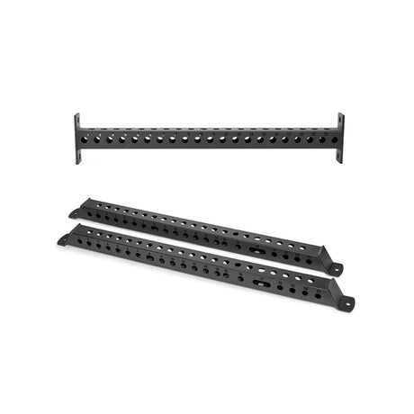 The Bells of Steel Manticore Flat Foot Components include three black metal brackets—two lying flat, one upright—with angled edges and mounting plates, designed to provide sturdy support for Manticore power racks.