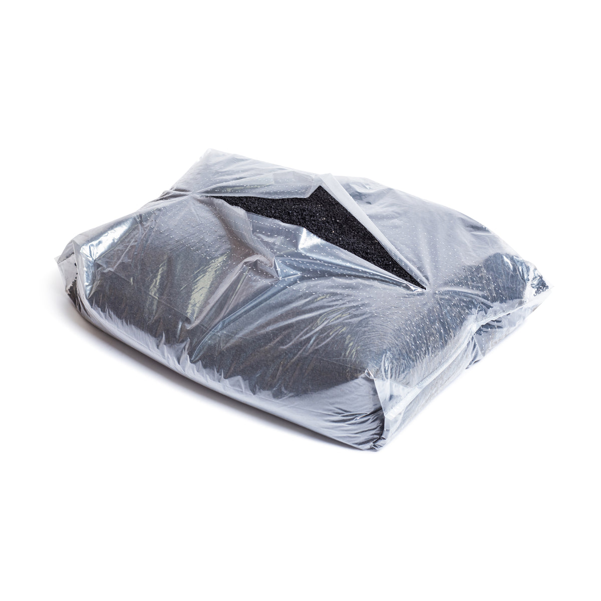 A partially open 40lb bag of Bells of Steel Recycled Tire Rubber Crumb Filler, containing black granular material made from recycled tires, sits on a white surface.