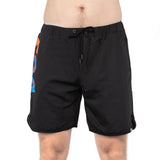 A person is wearing Bells of Steel Gym Shorts in black with a vibrant geometric side design. Crafted from high-performance polyester with a drawstring waistband, these durable shorts offer comfort and flexibility. The person's upper body is not visible.