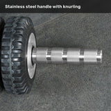 A close-up of the Bells of Steel ABsyidyan Stainless Steel Ab Roller with a knurled stainless steel handle, resting on a textured gray surface. The text above reads, "500 lb capacity stainless steel handle with knurling.