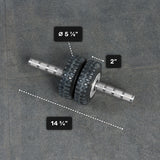 The Bells of Steel ABsyidyan Stainless Steel Ab Roller, with dual 5 5/8" x 2" wheels and a 14 3/4" handle, supports up to 500 lbs and is shown resting on a gray surface.