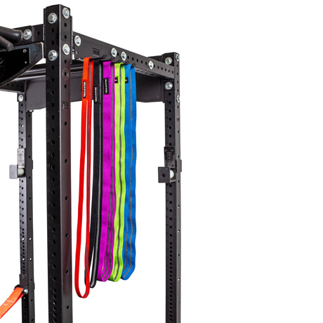 Accessory Holder attached to a power rack with different colored bands on it. 