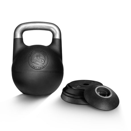 A Bells of Steel Adjustable Competition Kettlebell with a silver handle stands upright beside four stacked black weight plates, all displayed on a white background.