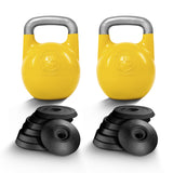 Two Bells of Steel Adjustable Competition Kettlebells with silver handles are shown alongside black weight plates, forming a versatile kettlebell set on a white background.
