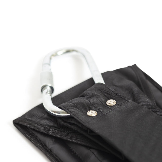 Close-up of a black fabric strap with metal rivets and a heavy-duty carabiner attached on a white background. The sturdy silver carabiner is ideal for securing or carrying items, similar to those used in Bells of Steel's Hanging Ab Straps.