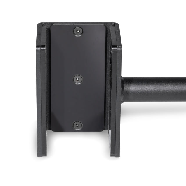 The close-up shows a Bells of Steel Adjustable Pull-up Bar Rack Attachment. It features a black metal bracket mounted on a horizontal cylindrical rod, with a flat rectangular piece secured by screws and flanked by two vertical panels, suggesting industrial or architectural adjustability.