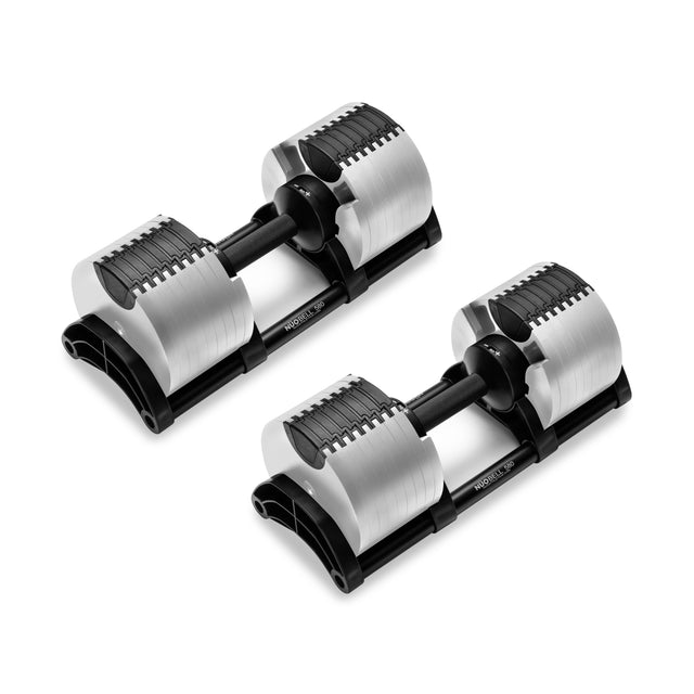 The NÜOBELL Adjustable Dumbbells by Nuobell boast a patent-pending design for strength training with silver dumbbells featuring black handles and stands, sleek machined steel weight plates, and a modern, durable look.