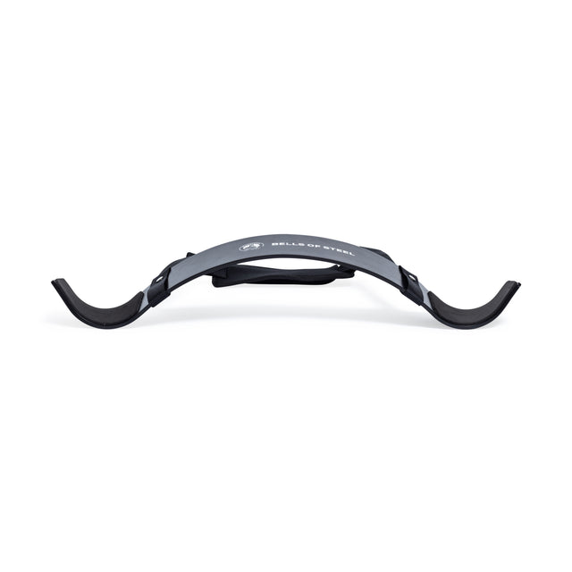 The Bells of Steel Arm Blaster is a black curling tool with curved ends, padded neck strap, and the brand’s logo on the front—ideal for weightlifting and biceps workouts.