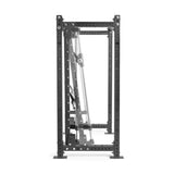 A black metal power rack by Bells of Steel Canada, viewed from the side, features adjustable pulleys and includes the Smith Machine Rack Attachment. It has multiple holes for attachments and a robust frame, making it ideal for weightlifting exercises with a barbell.