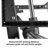 A close-up image shows a ruler measuring the distance between gym equipment and the Bells of Steel Smith Machine Rack Attachment, with precise millimeter alignment ensuring optimal setup for maximum weight capacity.