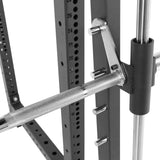 Close-up of a Bells of Steel Smith machine with barbell, featuring an adjustable metal frame and multiple height settings, emphasizing its compatibility with various Smith Machine Rack Attachments.