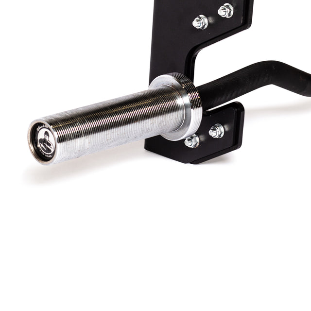 A close-up of a silver metallic barbell with a textured grip and threaded end, securely placed in the 3 Barbell Wall Rack by Bells of Steel on a black metal rack. The image emphasizes its robust construction and industrial design, featuring HDPE plastic lining for enhanced durability and protection.