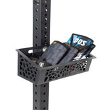 The Rack Attached Storage Basket attached to a rack upright, holding several home gym accessories